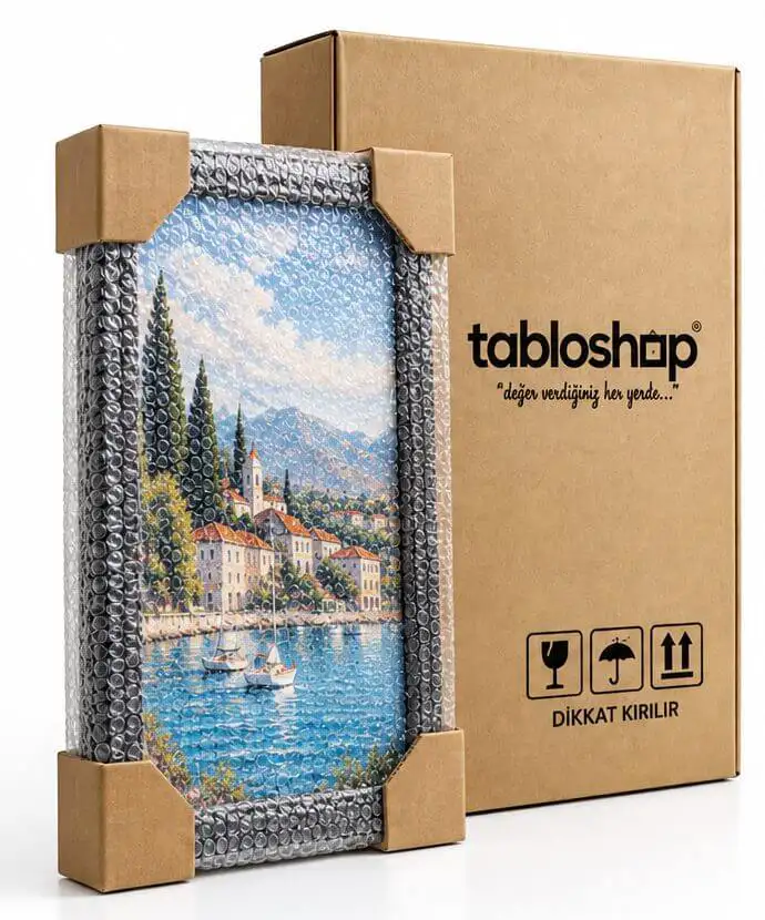 Karton köşe koruyucular ve balonlu naylonla korunan tablo ve TabloShop kargo kutusu